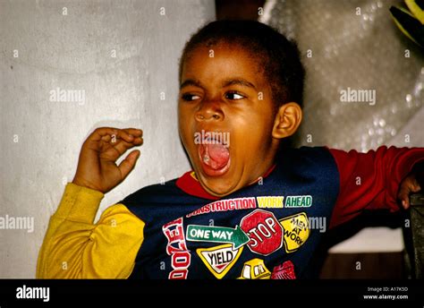 Five Year Old Cuban Black Boy Yawning Stock Photo Alamy