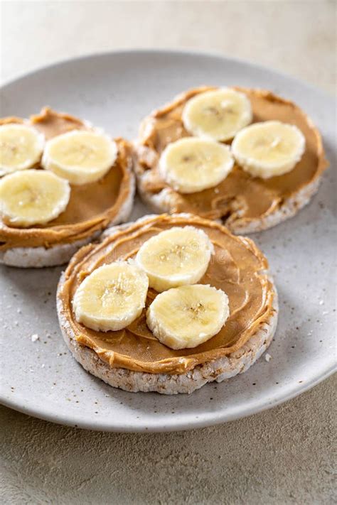 Rice Cake With Banana And Peanut Butter Healthy Protein Snack Stock