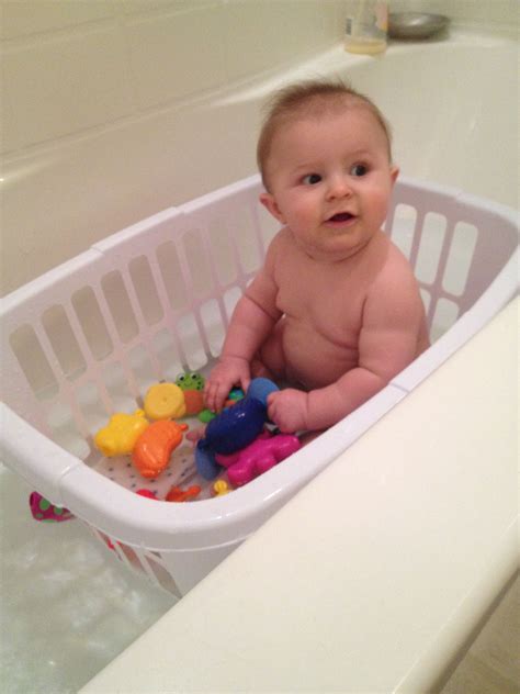 Use A Laundry Basket With Holes For Your Babies Bath Time When They