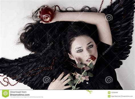 Dark Angel Girl With A Red Apple And Rose Royalty Free