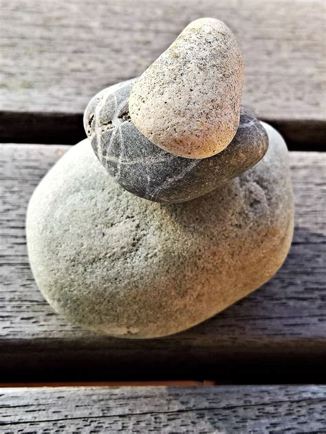 Hd Wallpaper Cairn On Brown Wood Plank Stones Pebble Stack Stone