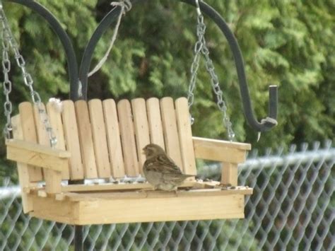 These 15 homemade bird feeders will enhance your yard and delight your fine feathered friends. Porch Swing Bird Feeder. (Handcrafted). $20.00, via Etsy.