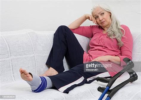 Mature Woman Crutches Photos And Premium High Res Pictures Getty Images
