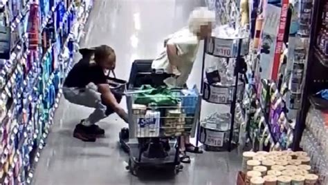 video woman caught on camera stealing elderly woman s purse