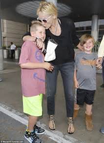 Sharon Stone Gives Son Roan A Tender Kiss At Lax While Keeping Arm Around His Brother Quinn