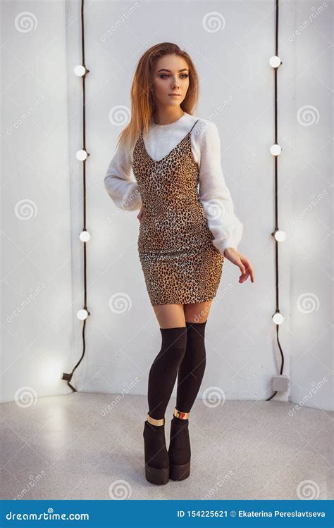 Beautiful Slender Girl Posing On Camera On White Background Stock Image