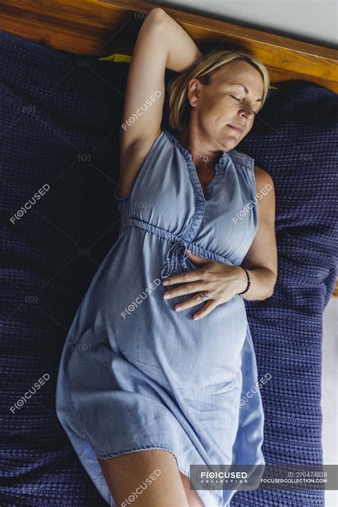 Mature Pregnant Woman Napping On Bed — Upper Body Expectant Mother