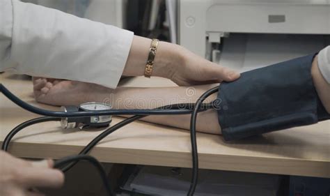 Doctor Measures Blood Pressure Of Patient Stock Image Image Of