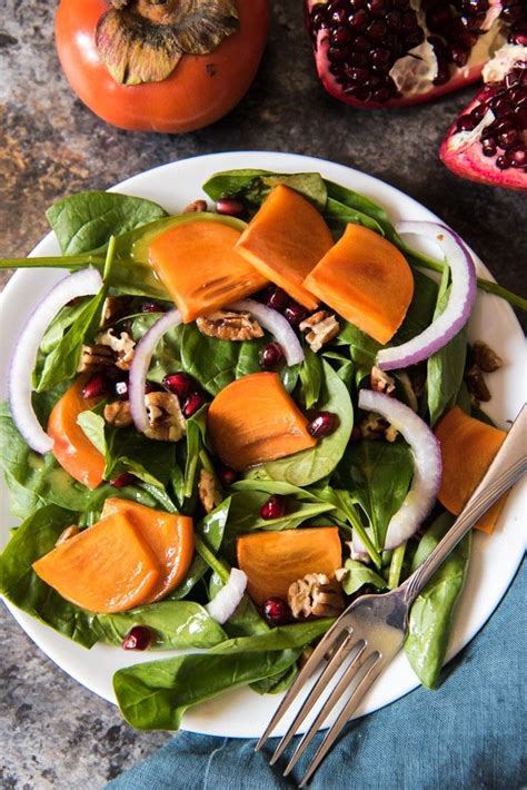 Persimmon Pomegranate And Spinach Salad With Maple Citrus Vinaigrette