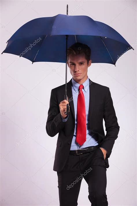 Business Man Holding Umbrella Stock Photo By Feedough