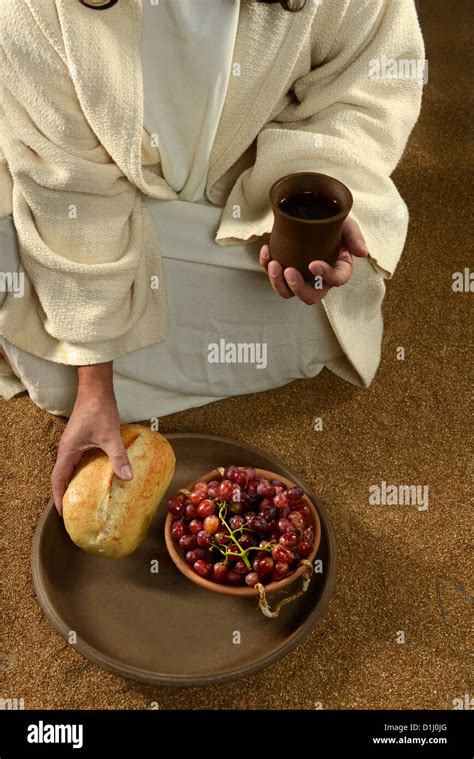 Jesus Hands Holding Communion Symbols Bread And Wine Stock Photo Alamy