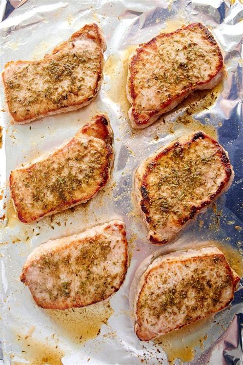 Place the pork chops on a greased baking tray and put them in the center of the oven. The Best Baked Pork Chops - quickly pan-seared then baked ...