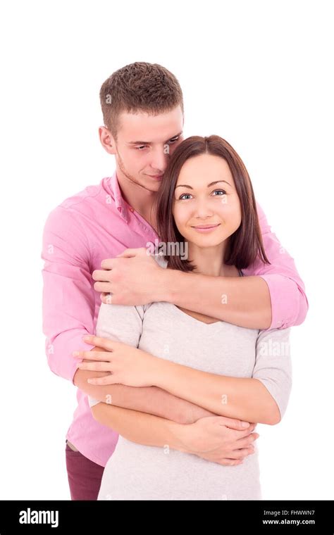 Young Beautiful Couple Embracing Woman Is Standing In Front Of The