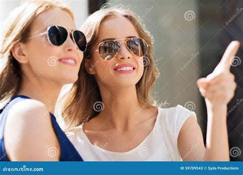 Happy Women In Sunglasses Pointing Finger Outdoors Stock Image Image