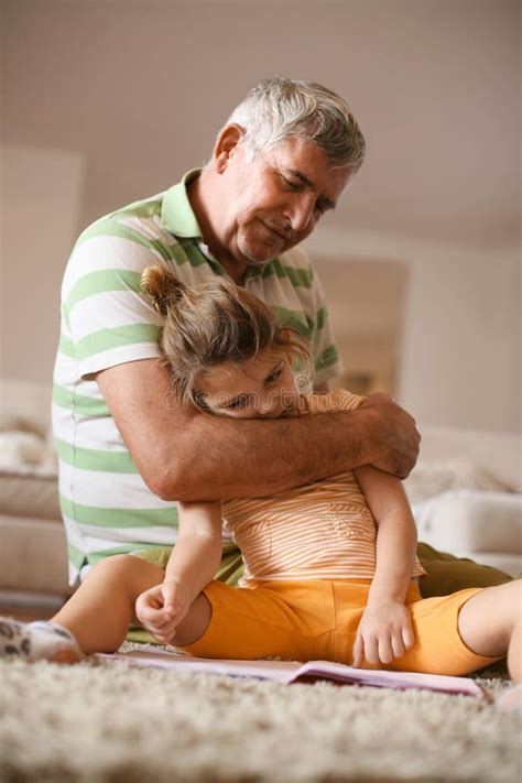Grandpa With His Granddaughter Fun On Floor Stock Image Image Of Discussion Interior 106437197