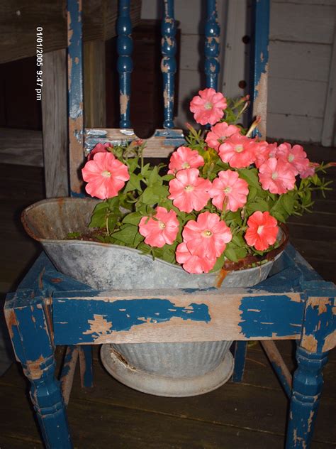Flowers In Old Coal Bucket Inside An Old Chair Garden Chairs Diy Yard Decor