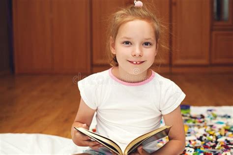Child Girl Reading A Book At Home Home Schooling Stock Photo Image