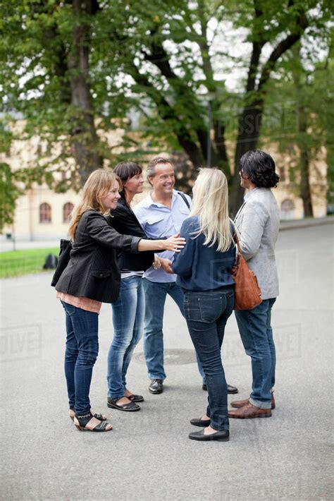 Group Of Business People Talking Outdoors Stock Photo Dissolve