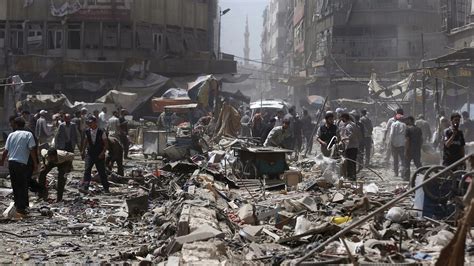 Scores Killed In Syrian Airstrikes On Rebel Neighborhood In Damascus