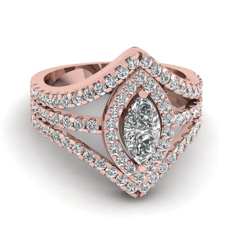 This engagement ring is a real show stopper. 18K Rose Gold Marquise Shaped Halo Engagement Rings | Fascinating Diamonds