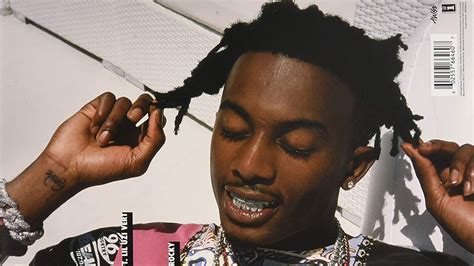 Playboi Carti Is Closing Eyes And Touching Hair With Fingers In White