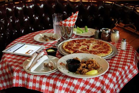 gino s east chicago pizzeria opens to hundreds of hungry customers