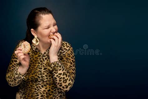 Fat Girl Eating Fast Food With An Appetite In The Hand A Bitten Donut Leopard Blouse Dark