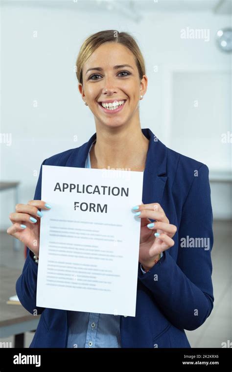 Successful Applicant Holding Up Her Application Form Stock Photo Alamy