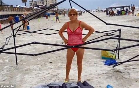 Two Inept Thieves Who Are Caught Stealing Beach Canopy On Camera Try To