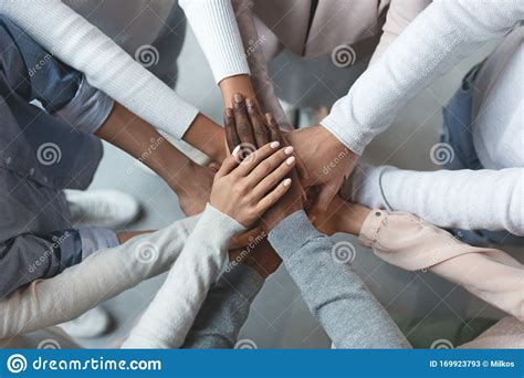 Business Team Putting Hands Together On Top Of Each Other Stock Image