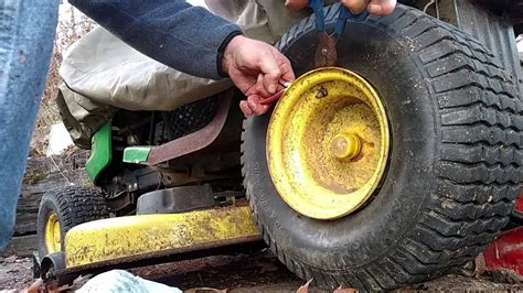 Start by removing the wheel. Tubing a John Deere L100 tractor rear tire - after fix-a ...