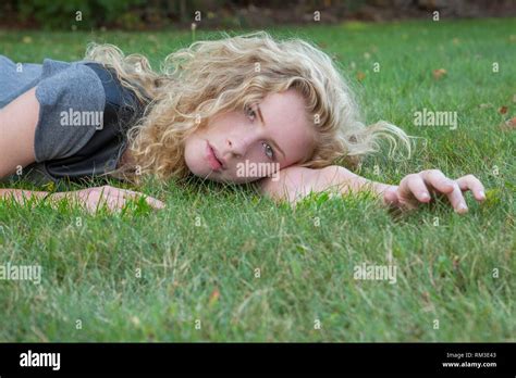 Teenage Girl Lying On Grass Hi Res Stock Photography And Images Alamy
