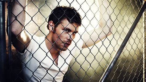 Damon Salvatore In White T Shirt Near Chain Link Fence Hd The Vampire