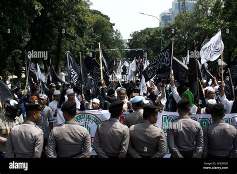 Indonesian Muslims Carrying Tawheed Flags And Other Attributes Staged