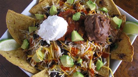 Loaded bell pepper nachos 1/4th of recipe (6 loaded nachos): Loaded Baked Nachos - The Healthy Way! - How Sweet Eats