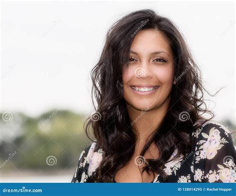 Portrait Of A Beautiful Hispanic Woman Happy And Smiling Stock Image