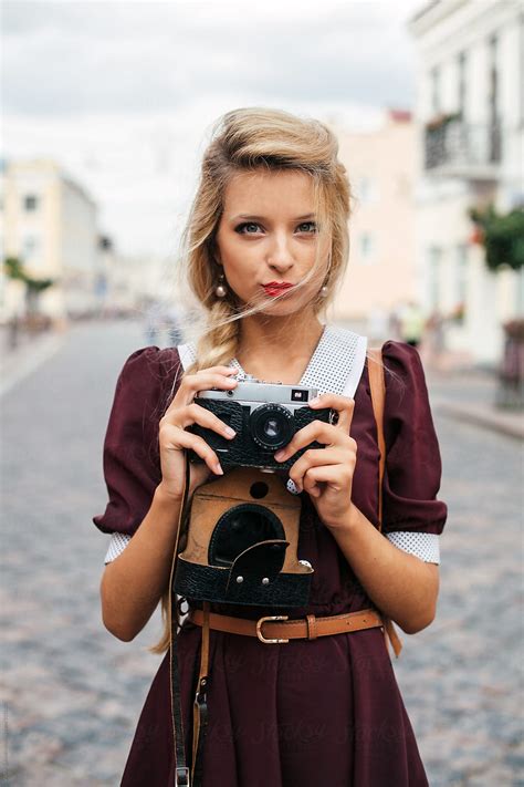 Vintage Style Blonde Girl With Retro Camera By Stocksy Contributor Viktor Solomin Stocksy