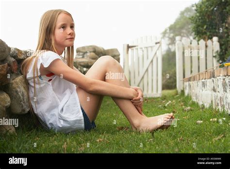 Person Sitting Hugging Knees ~ Preteen Girl Sitting On Beach With