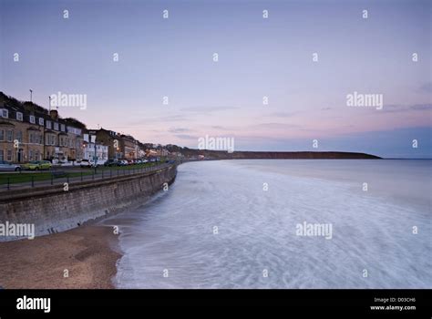 Filey Bay And Seafront Looking Up The Promenade As Day Turns To Night