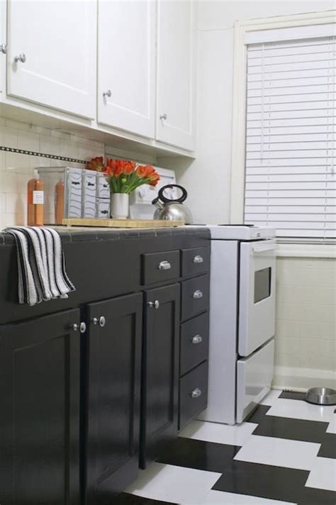 This kitchen design uses several. white upper cabinets dark lower cabinets vintage from ...