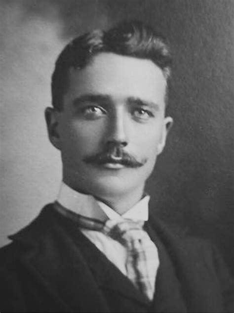 An Old Photo Of A Man With A Mustache