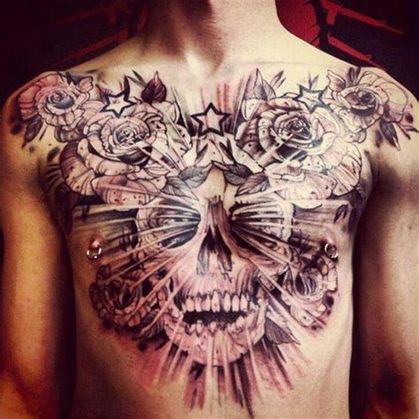 The tattoo artist paid attention to the details in this piece, using the lighting and colors so well that the tattoo looks more like a piece of art! Skull and roses chest piece | Tattoos | Pinterest | Skulls ...
