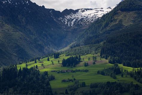 Idyllic Landscape In The Alps In Springtime With Traditional Mountain