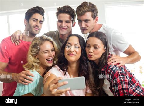 Friends Making Faces While Taking Selfie At Home Stock Photo Alamy