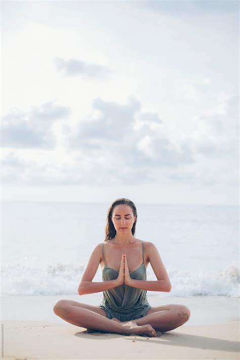 Woman Doing Yoga At Sunrise On The Beach Thailand Del Colaborador De Stocksy Studio Firma