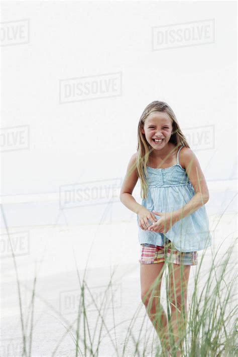 Girl Smiling On Beach Stock Photo Dissolve