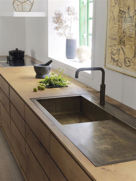 Nowadays, kitchen sinks come in a variety of shapes, sizes, and finishes, from traditional stainless steel and porcelain to more modern copper and black granite. 'Model Dinesen' bespoke wooden kitchen with browned brass ...