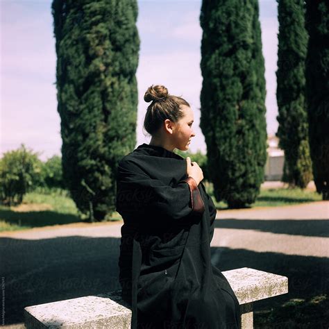 A Beautiful Woman Sitting On A Bench In Italian Park Del Colaborador De Stocksy Anna Malgina