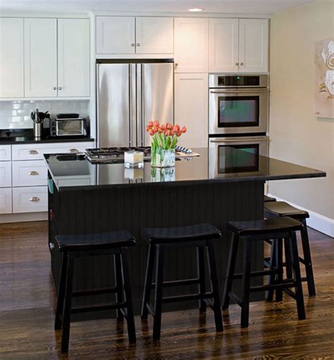 New decorated white kitchen at home with black granite. Black Kitchen Furniture and Edgy Details to Inspire You