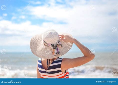 Backview Of Elegant Lady In Straw Hat Standing On Stock Image Image